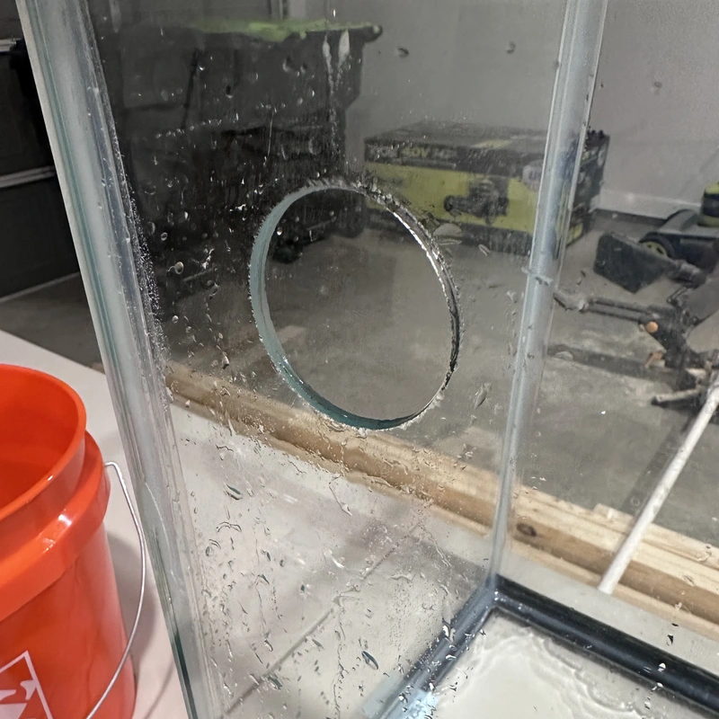 a completed cut of a hole in aquarium glass